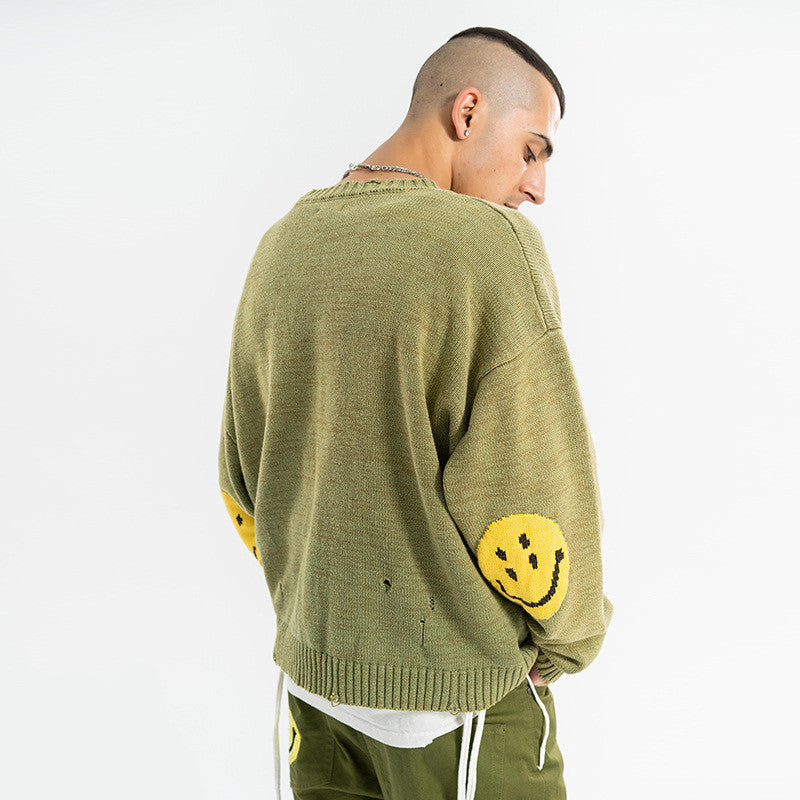 Distressed smiley face sweater
