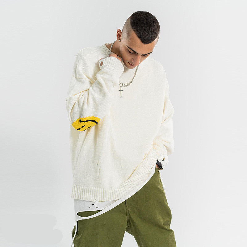 Distressed smiley face sweater